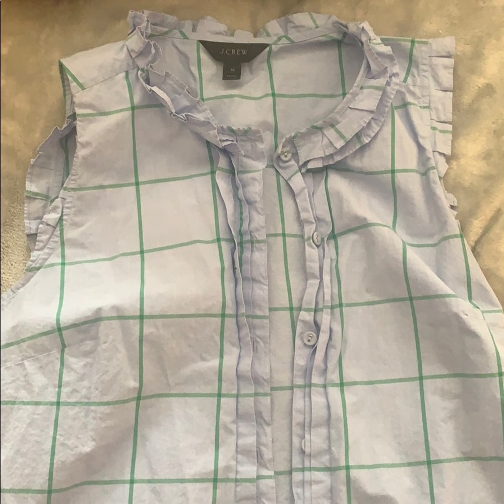 Sleeveless button-down blouse with ruffle collar